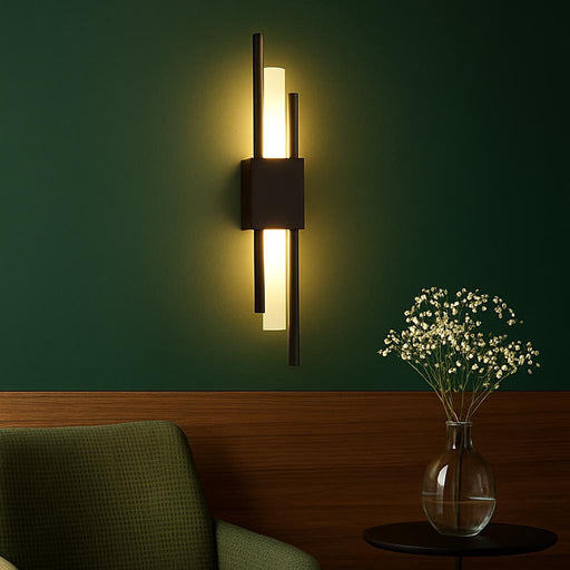 An interior scene showcasing the Lucas Wall Light in a contemporary living room setting, highlighting its warm illumination against a background of contrasting bold colors and natural wood textures.