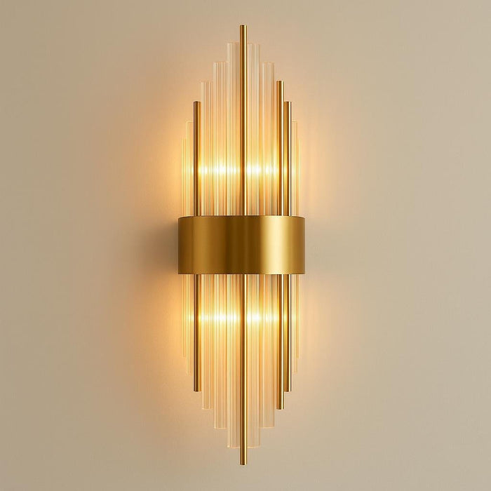 A sleek, modern Addo Wall Lamp mounted on a minimalist white wall in a contemporary living room, softly lit to showcase its warm, ambient glow and geometric design, with a focus on the matte gold finish and elegant proportions.