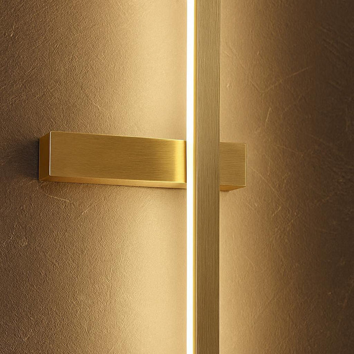 Close-up shot of the Dario LED wall light highlighting its high-quality aluminum construction and bold horizontal intersecting element, with soft warm white light illuminating a contemporary wall.