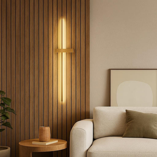 Lifestyle shot of a stylish living room corner with the Dario LED wall light mounted above a textured natural wood feature wall, blending minimalist decor with the warm glow to create a harmonious modern space.