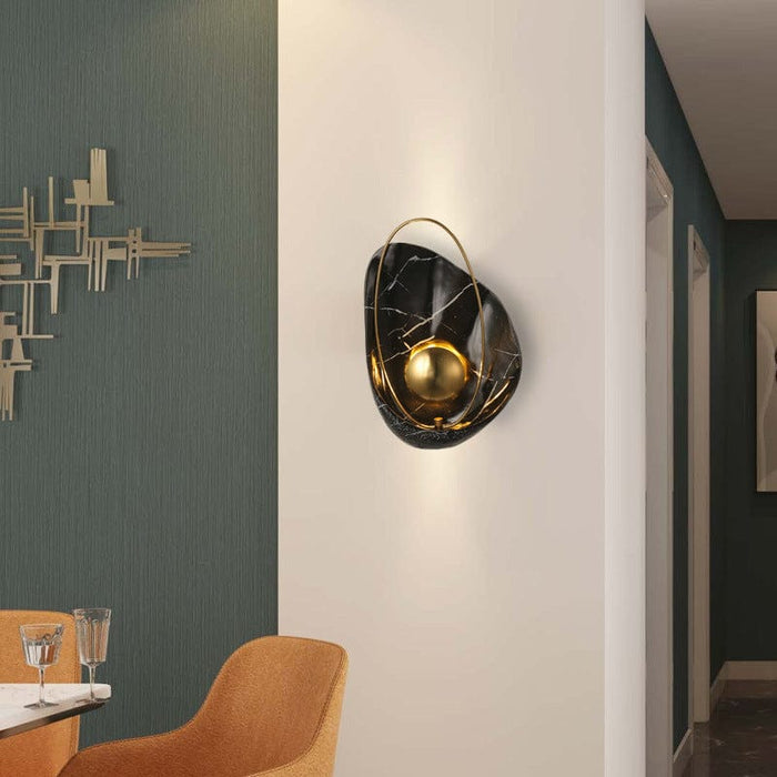 Casa black wall lamp with gold accent and curved design mounted on white wall, Mafeemushkil.com, Dubai, UAE Light. - Mafeemushkil.com LLC - Casa black wall lamp - Wall Lamps